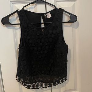 Black top with floral lace. Good condition, only worn a couple times. Brand H&M.